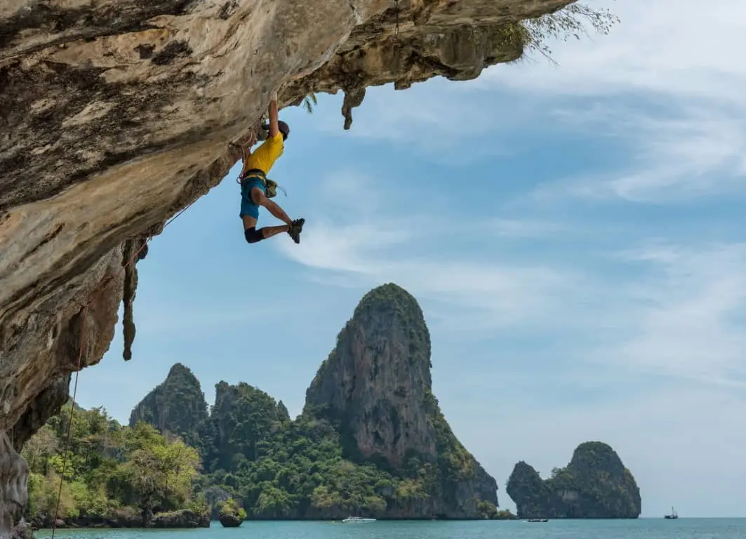 me climbing an overhanging cliff in Thailand